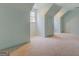 Bright bedroom with light-blue walls, carpet, and a window at 960 Todd Dr, Covington, GA 30014