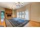 Dining room with hardwood floors, brick fireplace, built-in shelving, and French doors at 960 Todd Dr, Covington, GA 30014