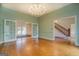 Dining room with hardwood floors, French doors, and a view into the living room at 960 Todd Dr, Covington, GA 30014