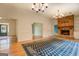 Dining room with hardwood floors, fireplace, built-in shelving, and views of other rooms at 960 Todd Dr, Covington, GA 30014