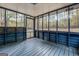 Relaxing screened porch with blue wood floors and wooded views at 960 Todd Dr, Covington, GA 30014