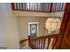 Grand staircase with wood railings and chandelier at 960 Todd Dr, Covington, GA 30014