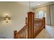 Upstairs hallway with wood railing and large window at 960 Todd Dr, Covington, GA 30014