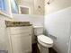Updated half bath with granite vanity and white tile at 2780 Mitchell Dr, Decatur, GA 30032