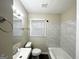 Clean bathroom with marble tile and updated fixtures at 2780 Mitchell Dr, Decatur, GA 30032