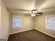Spacious bedroom with neutral carpeting and ceiling fan at 2780 Mitchell Dr, Decatur, GA 30032