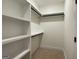 Spacious walk-in closet with built-in shelving and hanging rods for ample storage at 4619 Parkwood Rd, Social Circle, GA 30025