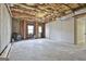 Unfinished basement space with concrete floor and exposed ceiling at 230 Hedgewick Way, Tyrone, GA 30290