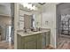 Bathroom with double granite sink vanity, large mirror, and views to other rooms at 230 Hedgewick Way, Tyrone, GA 30290
