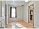 Bright bedroom features hardwood floors, natural light, and an access to a large closet at 230 Hedgewick Way, Tyrone, GA 30290