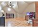 Bonus room featuring hardwood floors, built-in shelves, and a unique circular window at 230 Hedgewick Way, Tyrone, GA 30290