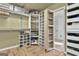 Walk-in closet with custom shelving provides ample storage for clothes, shoes, and accessories at 230 Hedgewick Way, Tyrone, GA 30290