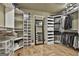 Spacious walk-in closet features custom shelving and storage for clothes, shoes, and accessories at 230 Hedgewick Way, Tyrone, GA 30290