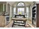 Bright dining area features lots of natural light, a modern light fixture, and a table for four at 230 Hedgewick Way, Tyrone, GA 30290