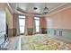 Dining room featuring hardwood floors, wainscoting and modern light fixtures at 230 Hedgewick Way, Tyrone, GA 30290