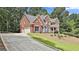 Beautiful brick home with attached garage, and a long driveway at 230 Hedgewick Way, Tyrone, GA 30290