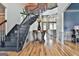 Open foyer features hardwood floors, staircase and high ceilings at 230 Hedgewick Way, Tyrone, GA 30290