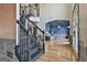 Bright foyer features an elegant staircase, hardwood floors, and an open view to the formal living room at 230 Hedgewick Way, Tyrone, GA 30290