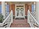 View of the front door entrance with double doors and nice landscaping at 230 Hedgewick Way, Tyrone, GA 30290