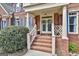 Inviting front entrance with double doors, brick steps, and classic architectural details at 230 Hedgewick Way, Tyrone, GA 30290