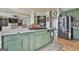 Spacious kitchen features granite island, stainless appliances and opens to the living room at 230 Hedgewick Way, Tyrone, GA 30290