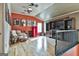 Bright living room with vaulted ceilings, hardwood floors, and red Smeg refrigerator at 230 Hedgewick Way, Tyrone, GA 30290
