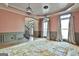 Bright living room featuring elegant lighting, natural light, and decorative wainscoting at 230 Hedgewick Way, Tyrone, GA 30290