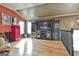 Bright living room with hardwood floors and a large entertainment center at 230 Hedgewick Way, Tyrone, GA 30290