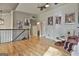 Open living area with hardwood floors, neutral walls, and ceiling fan at 230 Hedgewick Way, Tyrone, GA 30290