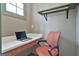 Functional office space includes a built-in desk, shelf, modern laptop and a comfortable chair at 230 Hedgewick Way, Tyrone, GA 30290