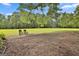 The home features a spacious lot with lush green grass and mature trees, perfect for outdoor activities at 230 Hedgewick Way, Tyrone, GA 30290