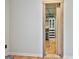 This large walk-in closet offers ample storage space with built-in shelving units at 230 Hedgewick Way, Tyrone, GA 30290