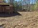 Brick house on a cleared lot with trees in the background at 8025 Creekwood Dr, Fairburn, GA 30213