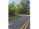 Wooded lot accessible from a paved road at 8025 Creekwood Dr, Fairburn, GA 30213