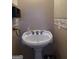 Powder room with pedestal sink and decorative wall accents at 100 Harmony Ct, Dallas, GA 30157