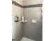 Clean bathroom with tiled shower and neutral color scheme at 100 Harmony Ct, Dallas, GA 30157
