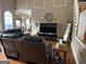 Spacious living room features a large sectional sofa and flat-screen TV at 100 Harmony Ct, Dallas, GA 30157