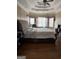 Main bedroom with king-size bed and bay windows at 100 Harmony Ct, Dallas, GA 30157