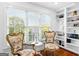 Bright sitting room with ornate chairs and built-in shelving at 1477 Highway 85 Connector, Brooks, GA 30205