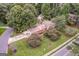 Aerial view highlights lush landscaping, surrounding trees, and convenient street access at 3170 Ebenezer Rd, Marietta, GA 30066