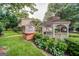 Landscaped backyard featuring a spa, gazebo, and lush greenery, perfect for relaxation and outdoor enjoyment at 3170 Ebenezer Rd, Marietta, GA 30066