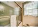 Bathroom featuring a shower tub combination, window, and decorative sheer curtain at 3170 Ebenezer Rd, Marietta, GA 30066