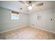 Bright bedroom featuring tile floors, a window, and a ceiling fan at 3170 Ebenezer Rd, Marietta, GA 30066