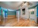 Bright bedroom with hardwood floors, built-in cabinets, closet, and adjacent bathroom at 3170 Ebenezer Rd, Marietta, GA 30066