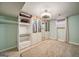 Bedroom featuring custom wardrobe closets, decorative shelves and a neutral patterned carpet at 3170 Ebenezer Rd, Marietta, GA 30066
