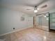 Cozy bedroom with a ceiling fan, mirrored closet doors, and neutral tile floors at 3170 Ebenezer Rd, Marietta, GA 30066