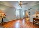 Bedroom featuring wood floors, large sliding-door closet, and two decorative side tables at 3170 Ebenezer Rd, Marietta, GA 30066