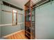 Walk-in closet featuring custom shelving, hanging racks, and a full-length mirror at 3170 Ebenezer Rd, Marietta, GA 30066