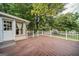 Large wooden deck with white railing, providing scenic views of the surrounding neighborhood and greenery at 3170 Ebenezer Rd, Marietta, GA 30066