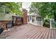 Expansive deck features a grill area, covered seating, and easy access to the home's sunroom at 3170 Ebenezer Rd, Marietta, GA 30066